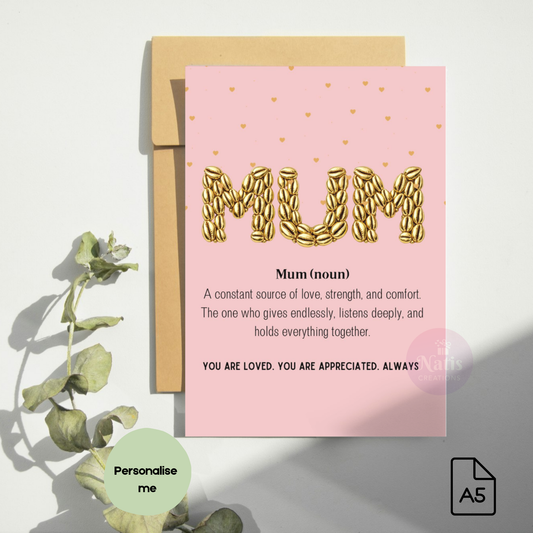 A5 greeting card by Natis Creations featuring the word MUM in gold cowrie shell typography. The card shows a dictionary-style definition of a mother as a source of love and strength, set against a cream background with small gold hearts and a kraft envelope.word 'Mum'.